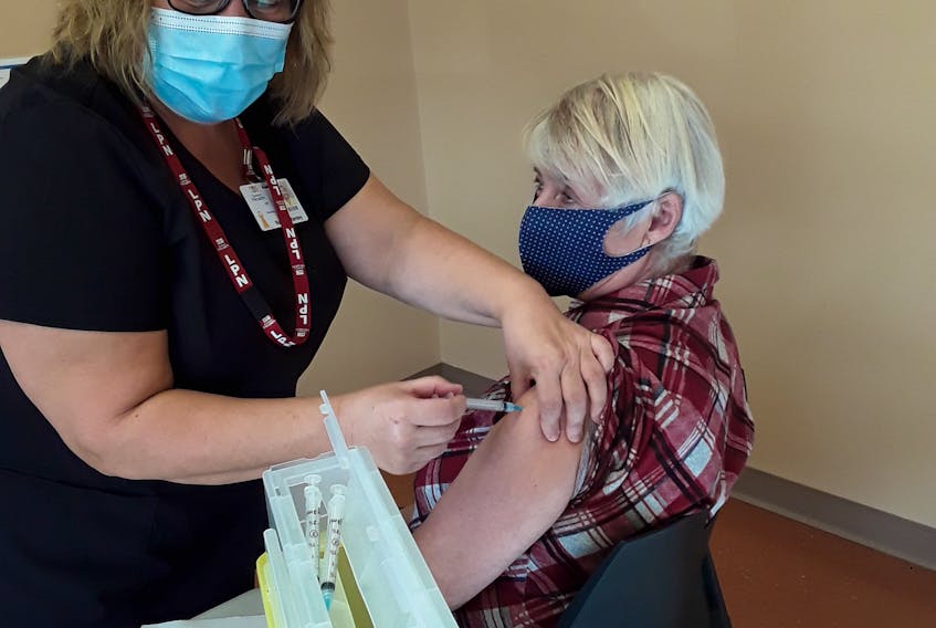 Nurse Nancy Stanley at the Mundy Pond clinic giving me a painless flu shot. — Contributed