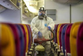 A plane is cleaned to help prevent the spread of coronavirus. — Reuters file photo