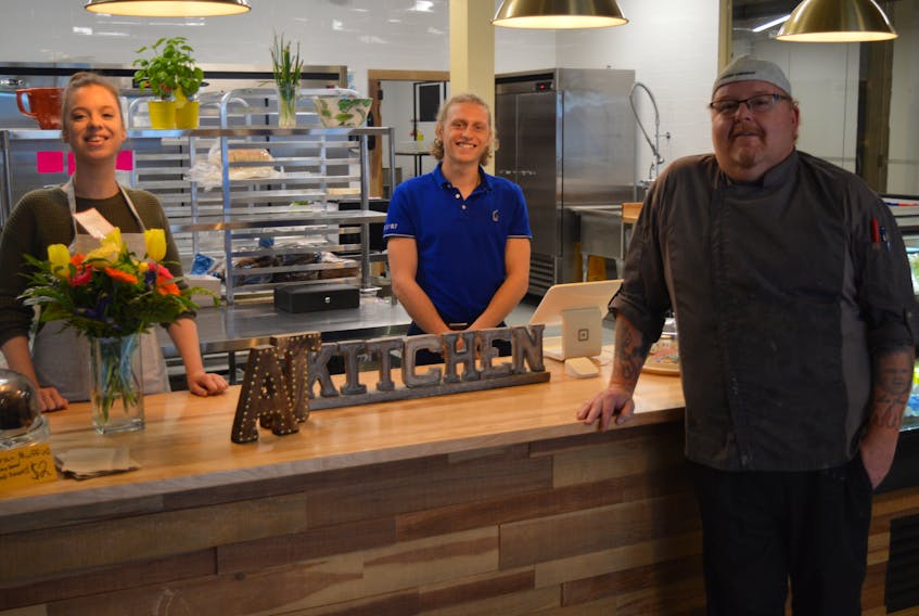 Amy Beaton, left, and Jason Horton, right, opened A.J.’s Kitchen and Catering on Kent Street in Charlottetown on May 4. They also brought on Joseph Beeley to help with some business savvy. 