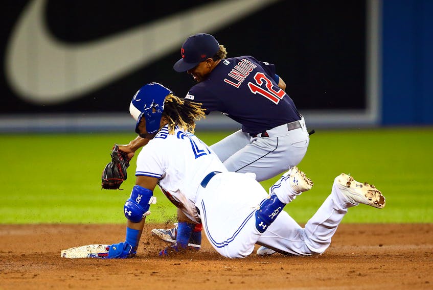 Jays' Vladimir Guerrero Jr. is tagged out by Cleveland's Francisco Lindor last night at Rogers Centre. (Getty Images) 
