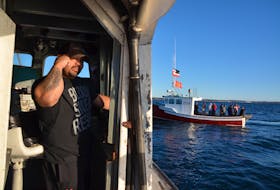 Terence Augustine aboard his vessel, The Lady Carol 1, looking for traps on Sunday evening that had been seized by commercial fisherment. (AARON BESWICK PHOTO)
