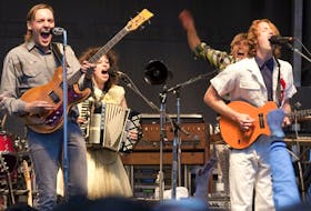  Arcade Fire — Win Butler, Regine Chassagne, William Butler and Richard Reed Parry — give a surprise free show in a Longueuil parking lot in 2010.