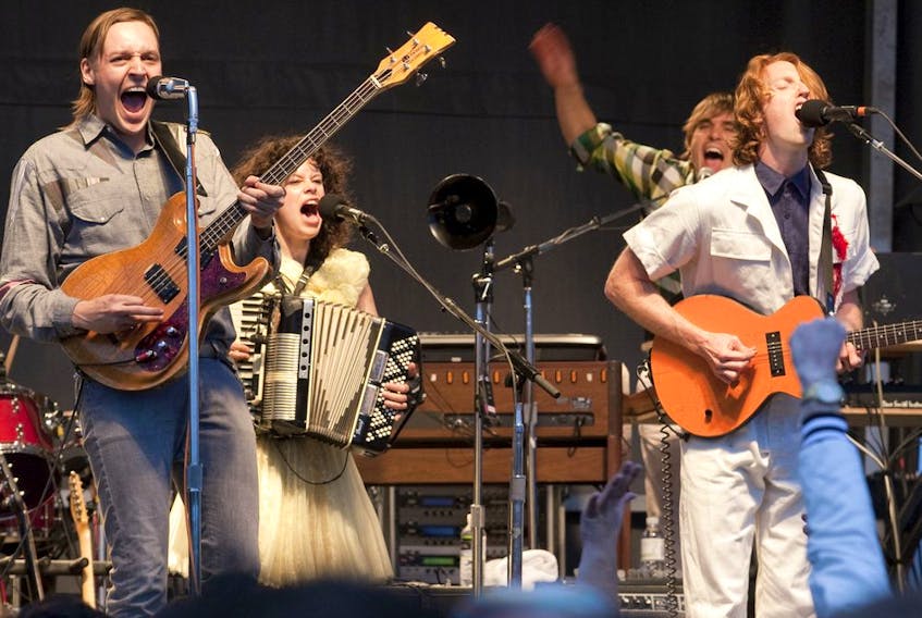 Arcade Fire — Win Butler, Regine Chassagne, William Butler and Richard Reed Parry — give a surprise free show in a Longueuil parking lot in 2010.