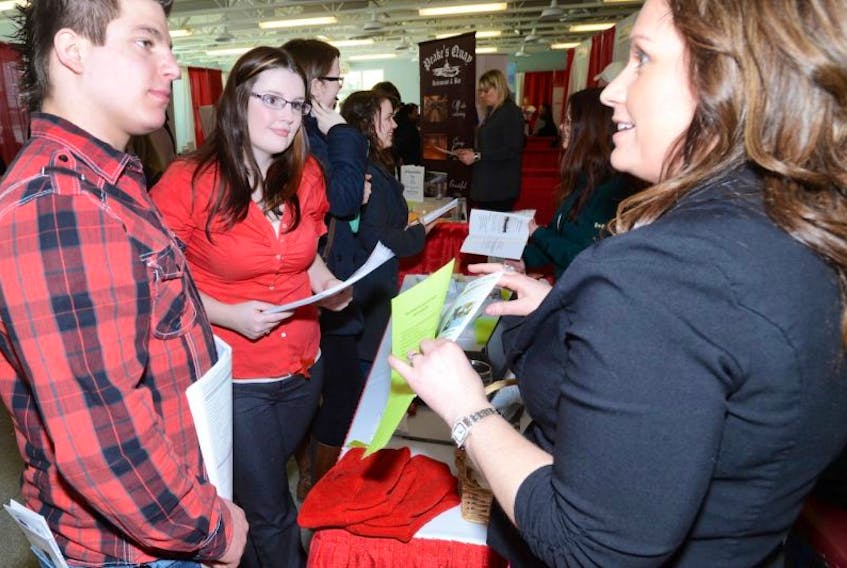 <p><span>Khalil Mourad, left, and Fallon Hughes talk with Karen Laverty, from Parks Canada, about job opportunities. The annual tourism industry job fair was held this week at the Culinary Institute in Charlottetown. It provided a networking opportunity for job seekers and employers. Guardian photo</span></p>