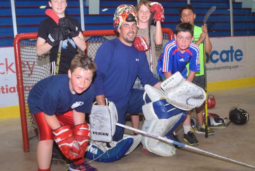 Former NHL goalie Joey MacDonald played some ball hockey on Saturday in Pictou. In front is Aaron MacInnis, while in back from left are Luke MacDonald, Camden MacDonald, Zachary MacInnis and Dominic Gibbons. KEVIN ADSHADE/THE NEWS