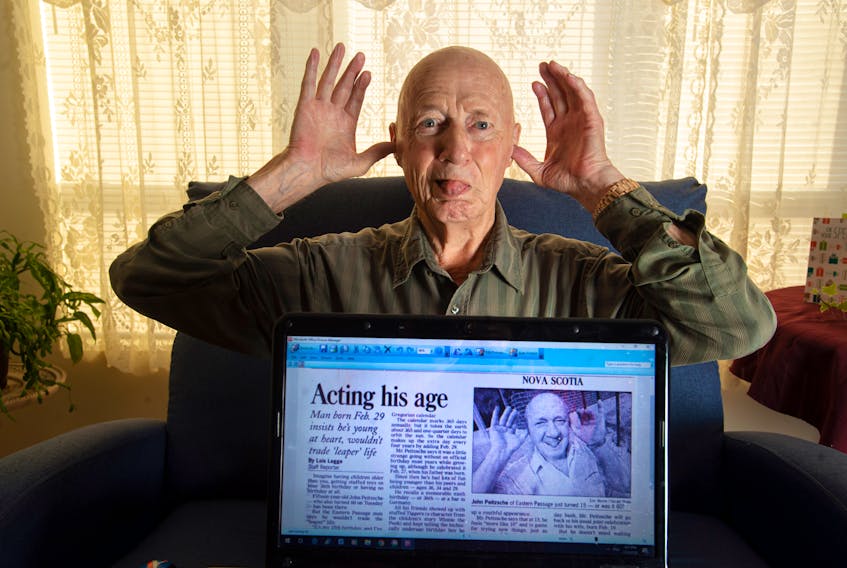 John Peitzsche, who turns 80 on Feb. 29, recreates a photo taken for the Chronicle Herald 20 years ago for his 60th (or 15th leap year) birthday at his Halifax home on Monday, Feb. 24, 2020. - Ryan Taplin