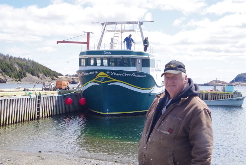 Rick Jones and the family’s newest longliner, the Pease Cove Endeavour, at Trinity East, NL. BARB DEAN-SIMMONS PHOTO
