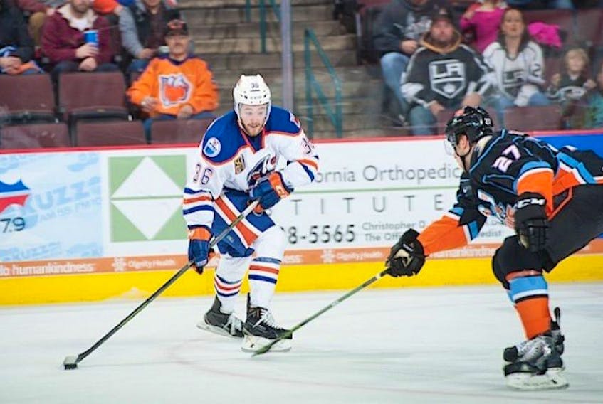 <p><span class="Normal">Josh Currie, left, is playing in the American Hockey League with the Bakersfield Condors.</span></p>
