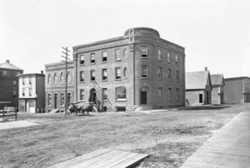 ['An historical photo of the Journal Pioneer office at the intersection of Water, Queen and Central streets in downtown Summerside.']