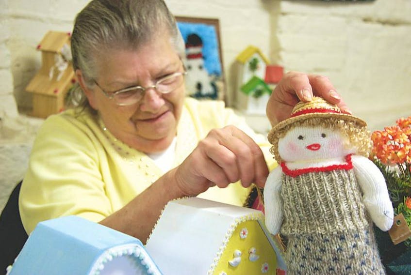 Joy Gallant puts the final touches on one of the sock dolls she makes and sells at the Summerside Farmers Market on Saturday mornings. Crafting has been a life-long passion for Gallant. Brett Poirier – Journal Pioneer