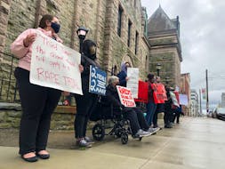Demonstrators calling for judicial reform and an end to sexual violence line up outside Newfoundland and Labrador Supreme Court on Duckworth Street in St. John's Monday morning. Inside, RNC Const. Doug Snelgrove, who is charged with sexually assaulting a woman while on duty in 2014, was arraigned on the charge for a third time.
