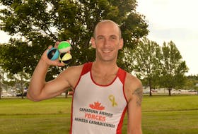 Michael Bergeron joggles – running and juggling at the same time – on his lunch break in Charlottetown Wednesday. Bergeron recently set a world record for joggling 5,000 metres in 16 minutes and 50 seconds.