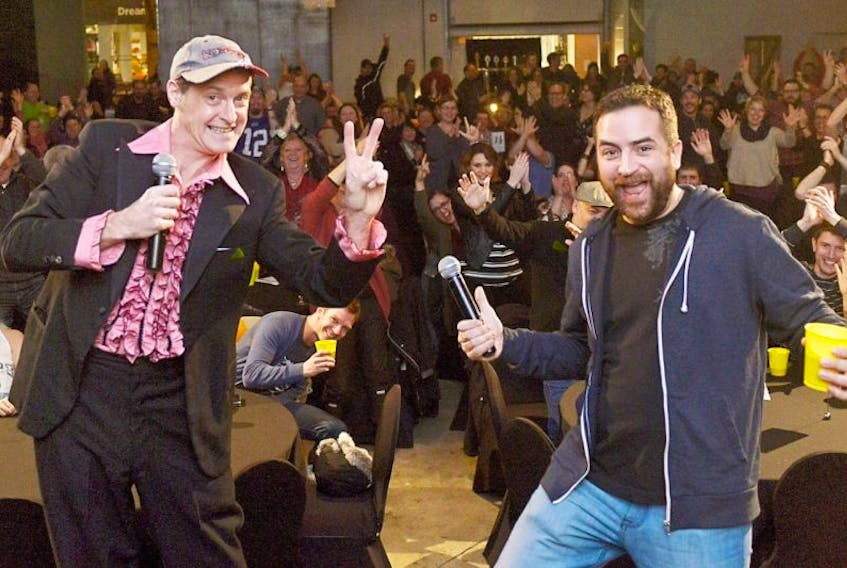 <p>Dennis Trainor, left, and Robbie Moses perform in character as Terry and Parnell Gallant to warm up a sold-out crowd during a screening of the second season of “Just Passing Through” at the P.E.I. Brewing Company last Saturday. The critically-acclaimed P.E.I. comedy series is available to view on YouTube.</p>