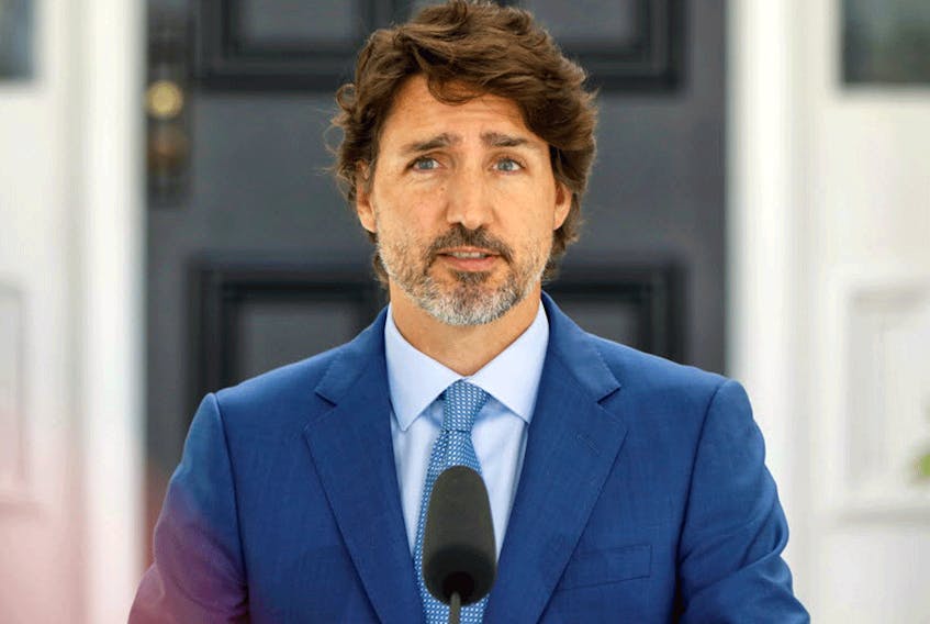 Prime Minister Justin Trudeau speaks to reporters at Rideau Cottage in Ottawa, July 13, 2020.