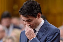  Prime Minister Justin Trudeau pauses while making a formal apology to LGBTQ2 individuals harmed by federal government actions and policies in Canada, in the House of Commons, Nov.28, 2017.