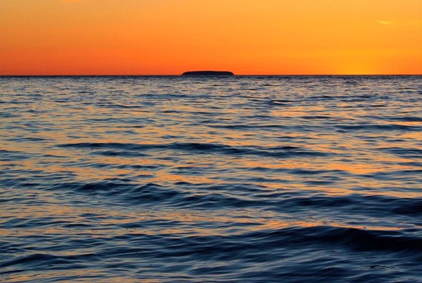 Kings County photographer Phil Vogler’s image of Isle Haute at sunset sets off its location in the Bay of Fundy.