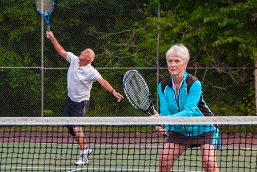 Bob Hainstock and his wife, Judy, enjoy a doubles game at the Wolfville Tennis Club. The club marks its 40th anniversary this year.