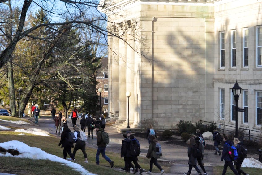 Students walking to class near the campus' University Hall building.