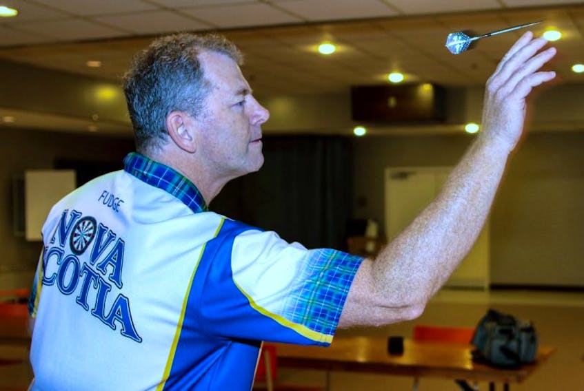Sheldon Fudge takes aim at the bullseye. Fudge, will be competing at the 2017 Winmau World Masters dart championship tournament in Bridlington, England on Sept 22 to 28 as a member of Team Canada.