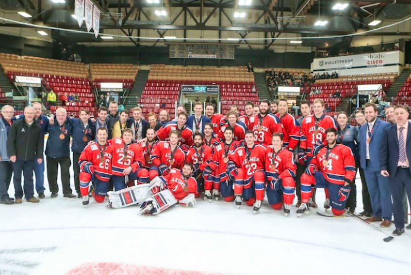 Acadia Axemen and team leaders pose with their bronze medals on March 19 in Frederiction after their final game at the nationals.