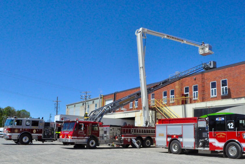 Two aerial trucks are visible at a May 24 fire at the CKF Inc. food packaging facility in Hantsport, during which an oven caught fire and spread to the ceiling.