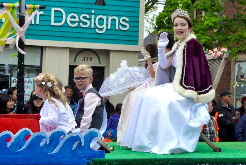 Queen Annapolisa LXXXVI Kendra Whitehead, formerly Princess Canning, waves to the crowd as she leads the 2018 Apple Blossom Festival Grand Parade event.
