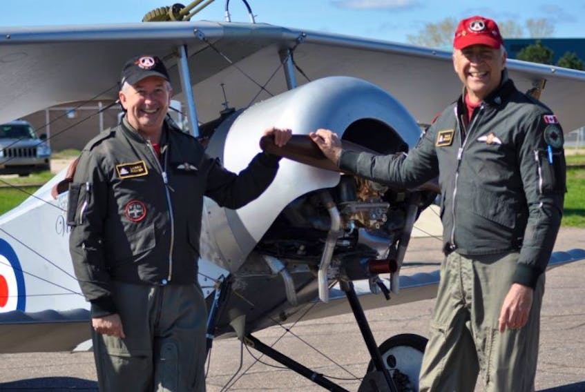 Vimy Flight pilots Larry Ricker and Dale Erhart posed for photos with their vintage First World War planes while visiting 14 Wing Greenwood May 4.
