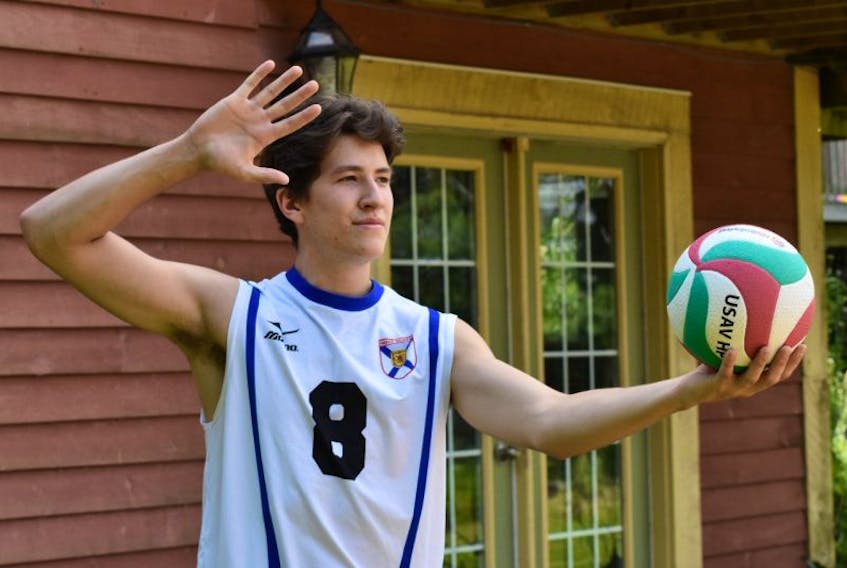 Simon Archibald lines up for a serve at the beach volleyball court located in the backyard of his family’s home in Aylesford. Archibald is representing Team Nova Scotia in the Canada Summer Games in Winnipeg.