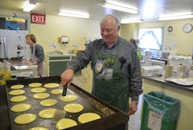 Volunteer Jim Taylor flips flapjacks at the Eagle Watch pancake and sausage breakfast at the Sheffield Mills Community Hall in 2016.