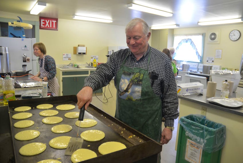 Volunteer Jim Taylor flips flapjacks at the Eagle Watch pancake and sausage breakfast at the Sheffield Mills Community Hall in 2016.