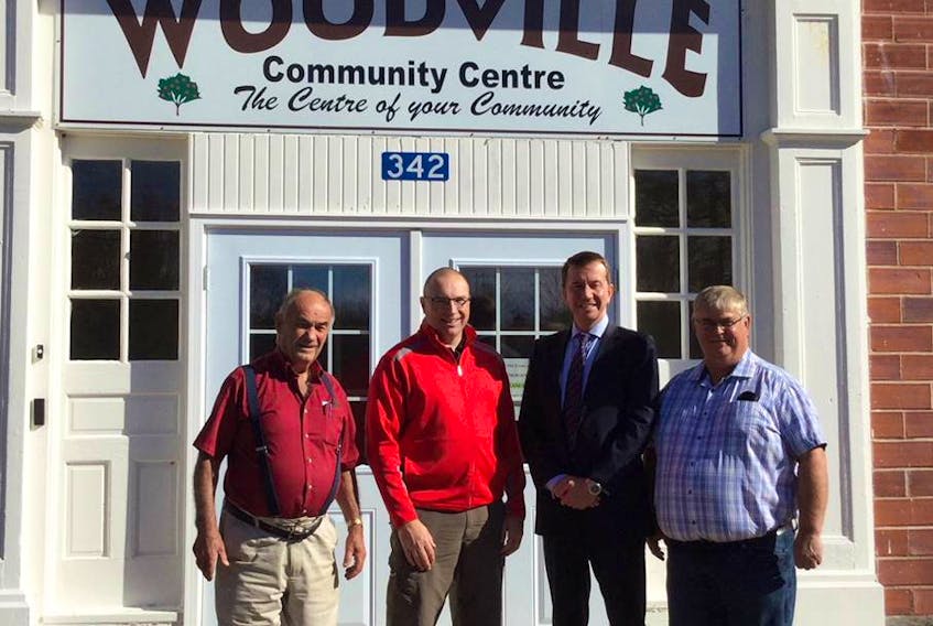 Woodville Community Centre president George Foote, vice president Dan Keddy, Kings-Hants MP and President of the Treasury Board Scott Brison and Kings County Coun. Brian Hirtle at the Woodville Community Centre, which has received a grant from the Atlantic Canada Opportunities Agency (ACOA). - Submitted
