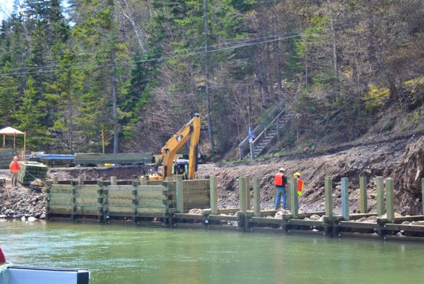 Work on rebuilding the west side of the Hall’s Harbour wharf continues on May 8.