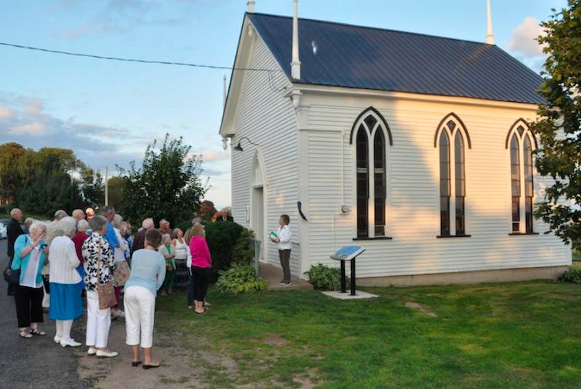 A congregation gathered before the North Grand Pré Community Church recently to hear about its new heritage status.