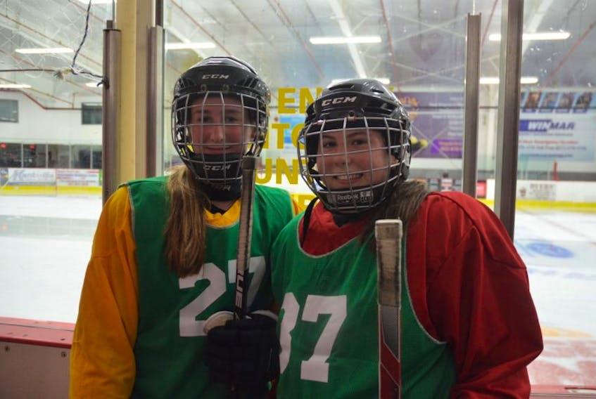 13-year-old Kinzee Veinot of Kingston and 14-year-old Rachel Baker of Kingston, bantam-level players, are having a great time in the Valley Wild female hockey program.
