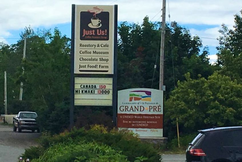 Two lines on this business sign at Just Us! Coffee in Grand Pre have provoked lots of discussion this week.