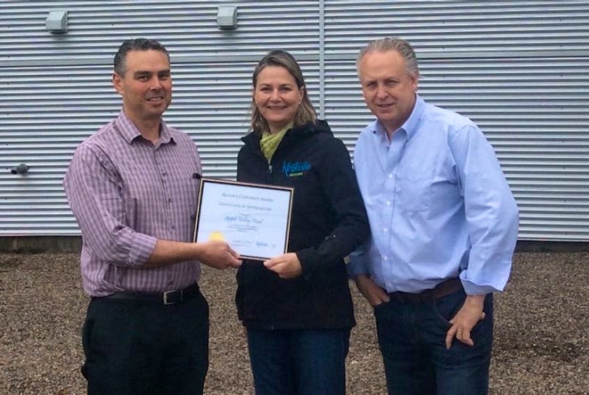 Kentville Mayor Sandra Snow presents the Mayor’s Corporate Award to Apple Valley Foods representatives John Pettet and Jeff Sarsfield.