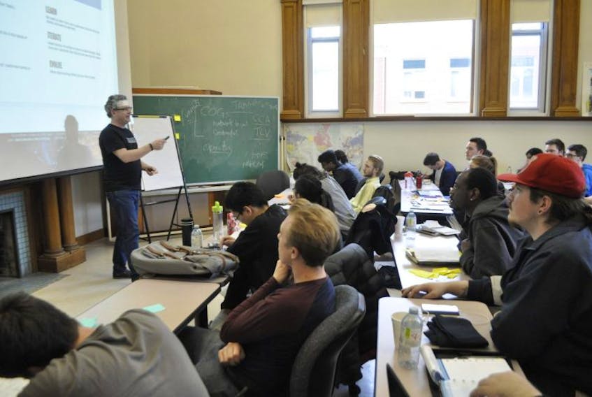 John Robertson instructs students in the Innovation Bootcamp at Acadia University in entrepreneurship.