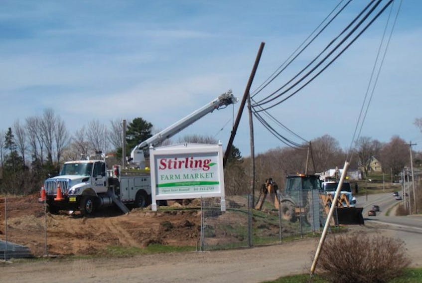 After some digging, moving power poles April 19 was the next task in the construction of a new Stirling Farm Market in Greenwich.