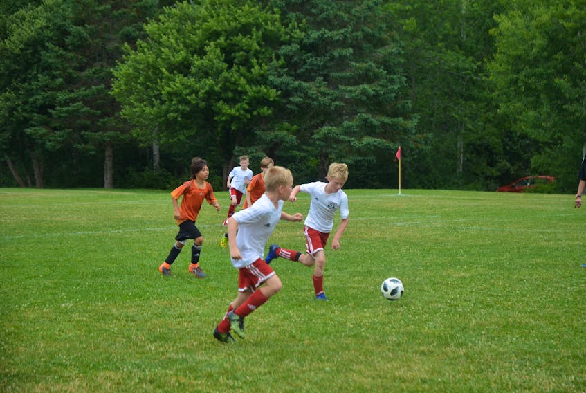 Arlo Kelday and Ethan Ostrander of the Valley United U-10 Boys soccer team strive for the net during the July 21 game against Storm.