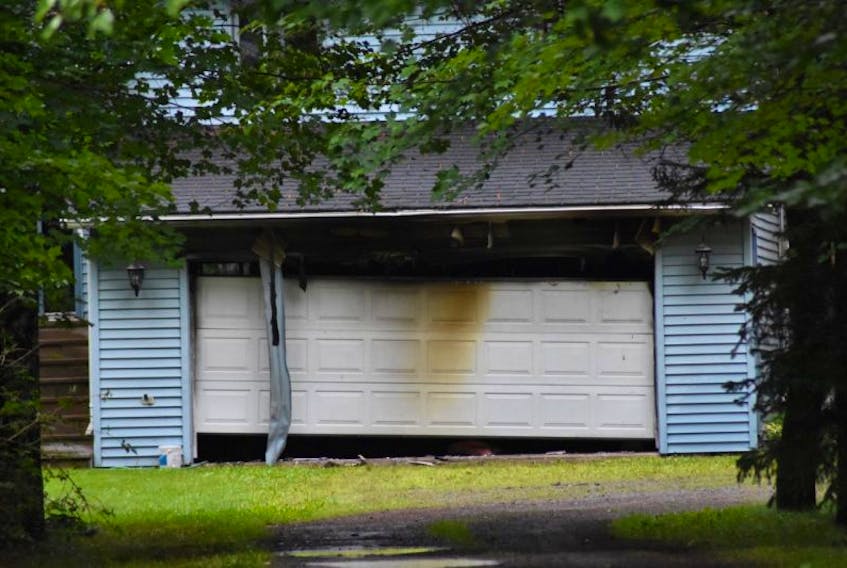 Firefighters extinguished a blaze in this attached garage while responding to a structure fire call in Waterville July 25.