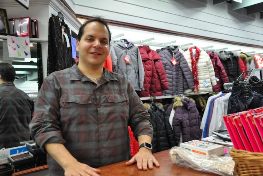 Andrew Zebian, owner of the Phinneys clothing store on Webster Street, happily participates in the Shop Kentville to Win contest that draws more people to Kentville throughout the holiday season.