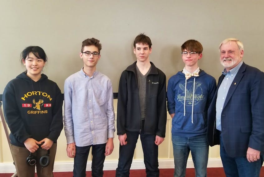 Young entrepreneurs Emma He, Gerald Kaulback, Max Caplan and Alex Petkov are recognized by Kings South MLA Keith Irving for winning the recent Start It Up competition.
