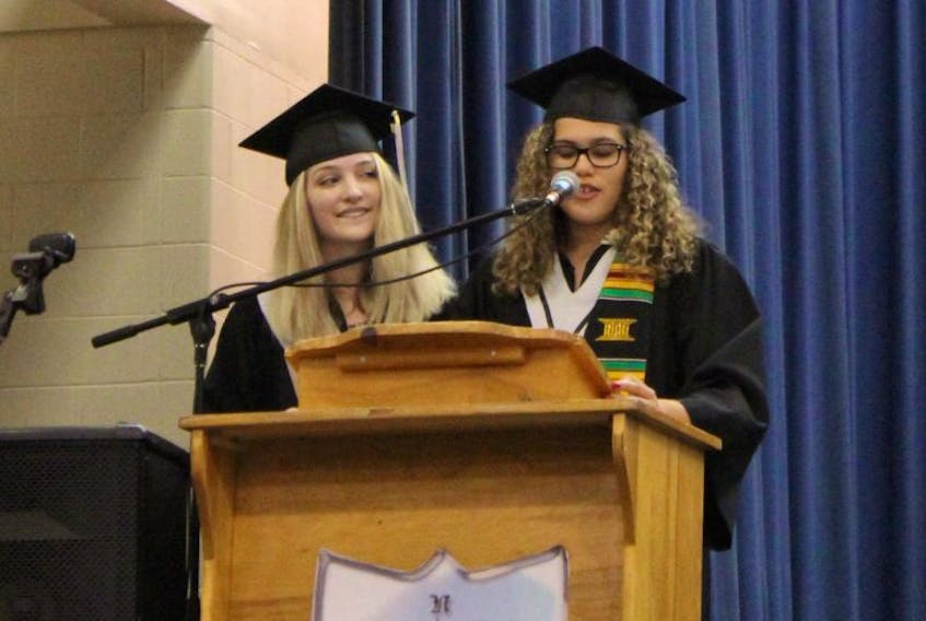 Shirley Hodder, who was selected as a co-valedictorian along with fellow NKEC student Lily Bateman (left) this year, received the $6,000 Dr. P. Anthony Johnstone Memorial Entrance Scholarship at her school’s graduation ceremony June 28.