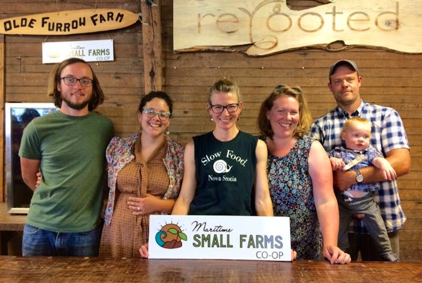 Happy members of the Maritime Small Farms Co-op include: Adam and Courtney Webster, left, Jocelyn Durston, and Anne and Joel Huntley with baby Connor.