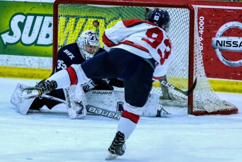 Brett Thompson of the Acadia Axemen scores a goal in an earlier play-off game this season.