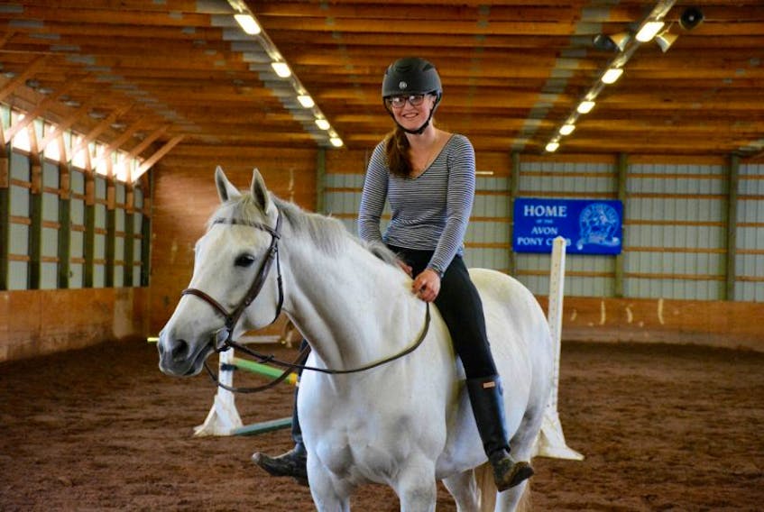 Maddy Singer with her horse Brilliant at the Hants County Exhibition Grounds where they were getting ready for the Windsor Spring Horse Show from May 18 – May 21.