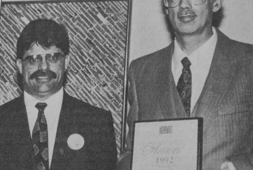 Education Minister Guy Le Blanc presented Roger Taylor, right, with an Education Week award on behalf of his musical leadership at Brooklyn Elementary School in 1992.