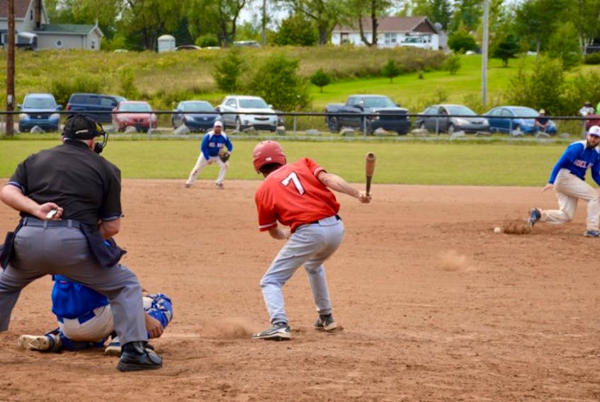 Paul Humphreys, number 7 with the Windsor Knights, hits the pall past Noel Road Jays pitcher Justin Campbell.