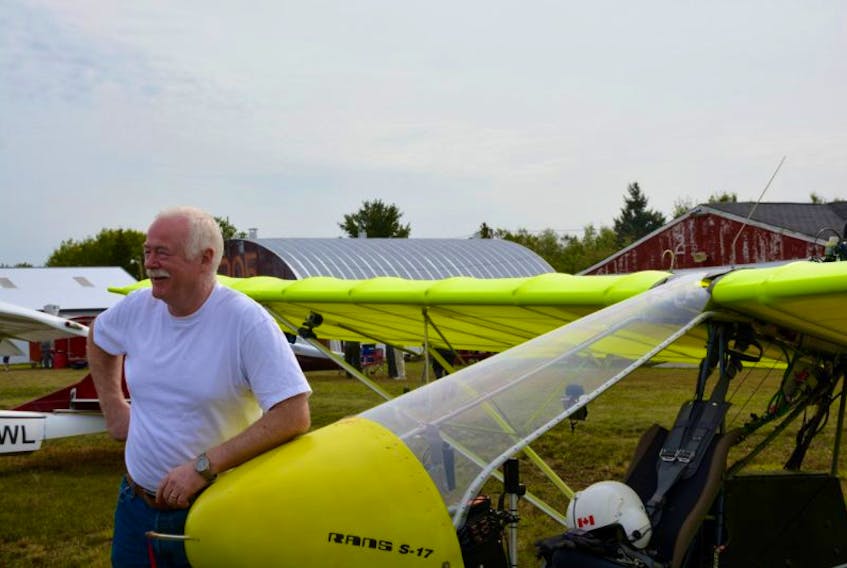 Mike Whitehead shows off his neon green Rans S-17 Stinger, which he assembled himself in his basement. Whitehead said the fly-in gives enthusiasts and pros a chance to swap stories and develop friendships.