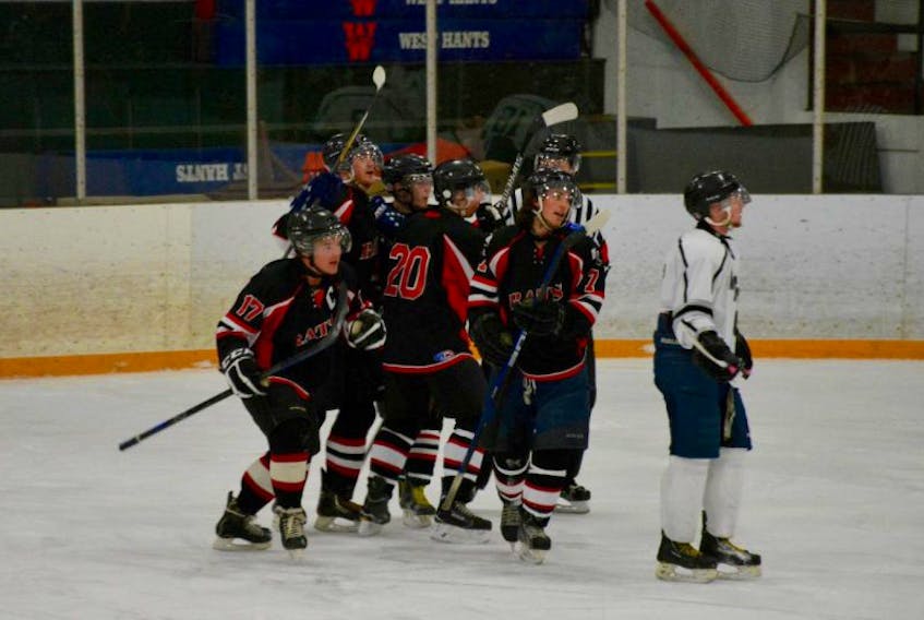 The Avon River Rats celebrate a goal by Peter MacDougal in the first period of a game during the 2016/17 season. The team is getting ready for a busy season this year, with their first home game scheduled for Sept. 24, 2017.